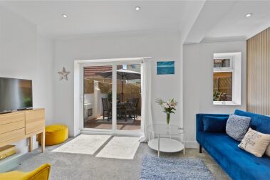Spacious lounge opening onto courtyard garden