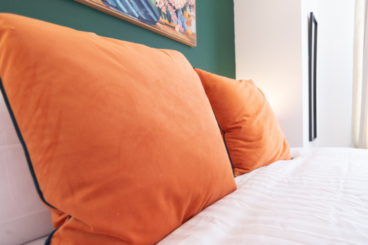 Comfortable bedding with fresh linens for a restful night’s sleep.