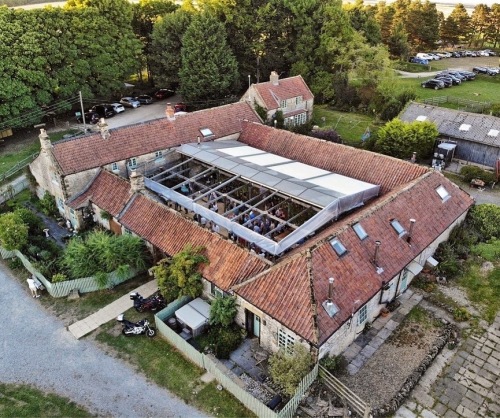 High Paradise Farm - aerial view of courtyard with retractable roof