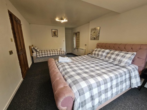 Master bedroom with king size bed and one single bed