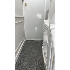 This photo represents the interior of the communal building hallway. 