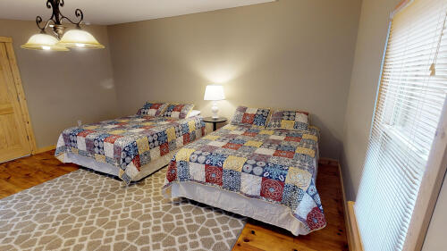 Bedroom 5 comfortably accommodates 2-4  guests in its 2 Queen sized beds.