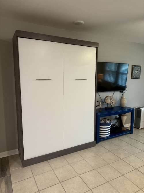 Murphy bed (queen) pulls down for convenient extra sleeping space