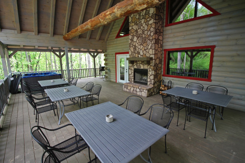 Outdoor Dining Area and Outdoor Fireplace, Deck, Back Forest Beyond, Rustic Cedar Inn 