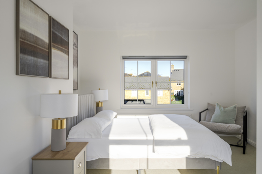 Sink into a luxurious double bed dressed in premium linens, framed by soft lighting and calming tones. This serene sanctuary offers a hotel-quality sleep experience and a peaceful escape from the day.