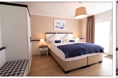 Schlafzimmer 1 mit TV, Kleiderschrank und Balkon