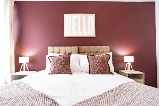 Stylish bedroom with zip-and-link king bed that can be arranged as twins.