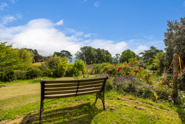 Relax and enjoy the back garden and sea view