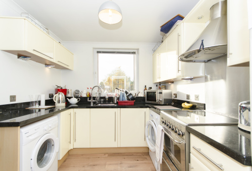 Well-equipped kitchen with granite worktops, washing machine and tumble dryer