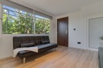 First Floor Apartment living room, with a sofa bed for one adult and the television.