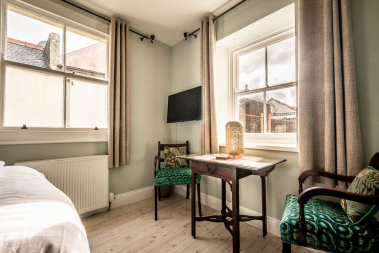 Cosy bedroom with dining area and TV