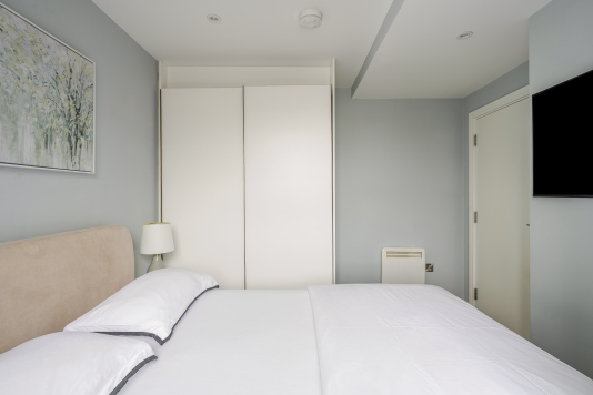 Retreat to this serene and stylish bedroom, designed for ultimate comfort and relaxation. With plush bedding, elegant décor, and soft ambient lighting, it offers a peaceful, luxurious haven to unwind and recharge.