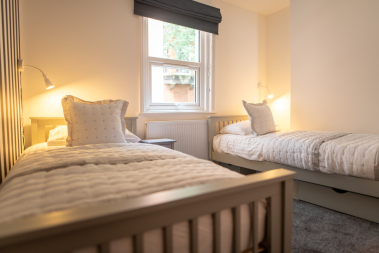 Second twin bedroom with two full size single beds