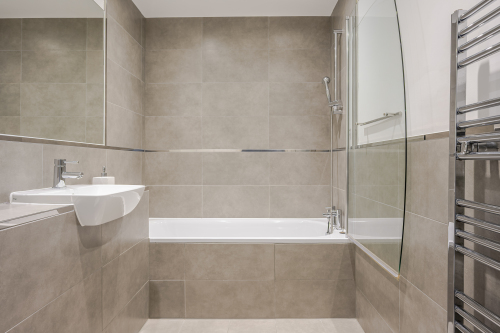 Indulge in a spa-like bathroom featuring premium fixtures, sleek finishes, and a soothing ambiance. Designed for relaxation, this modern space transforms everyday routines into a luxurious experience.