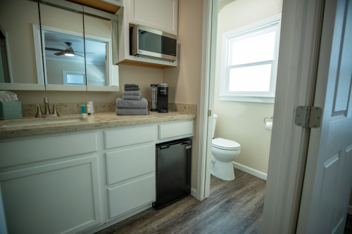 Kitchenette with coffee maker, microwave and refrigerator