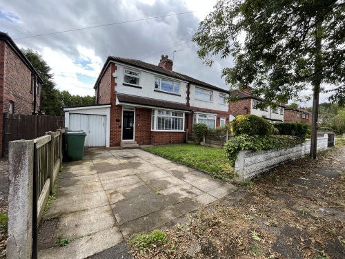 Private parking area and front garden - Garage not in use