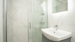 Clean, fresh, modern ensuite bathroom with walk in shower. Toiletries and towels provided Apt 5 
