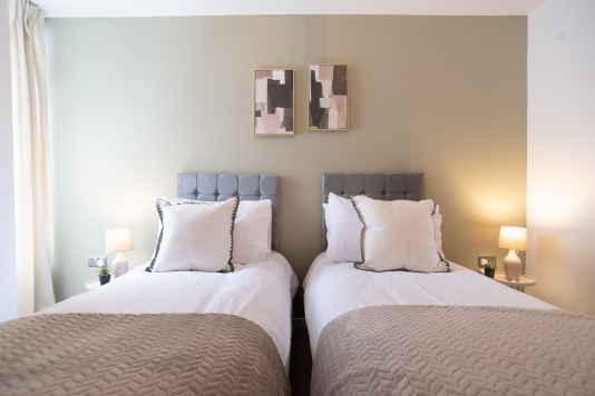 Zip-and-link beds arranged as twins for flexible sleeping