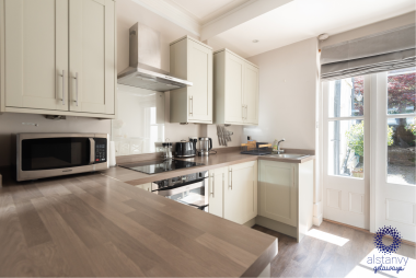 Fitted kitchen with oven, induction hob, washer dryer and full size fridge freezer 