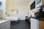 Fully self-contained studio with bedroom, kitchen and dining area
