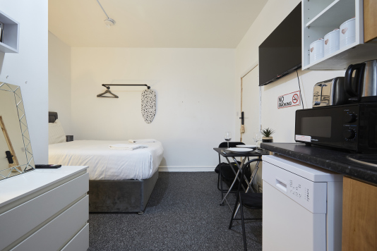 Fully self-contained studio with bedroom, kitchen and dining area