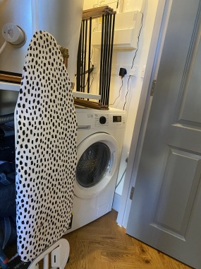 laundry cupboard with washer dryer