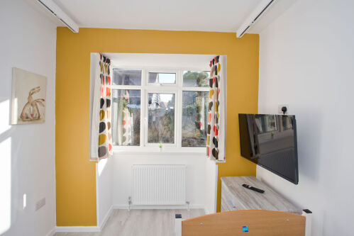 secluded back patio garden with ramp