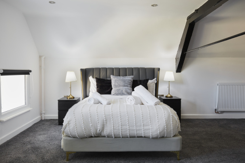 Settle into this serene double bedroom a peaceful space to recharge.