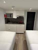 Apt.13Living space with 2 single beds