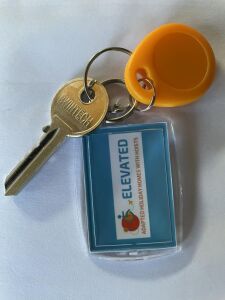Front door key with Changing Places Fob