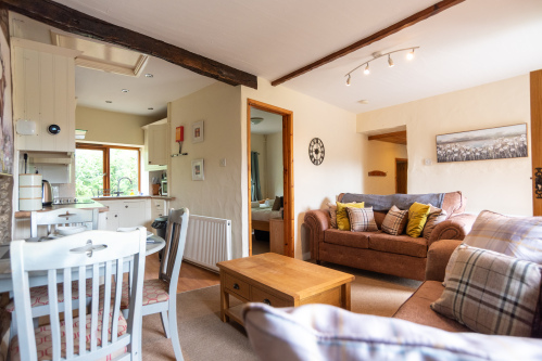 Open-plan lounge, dining and kitchen space designed for relaxed family holidays and countryside escapes.
