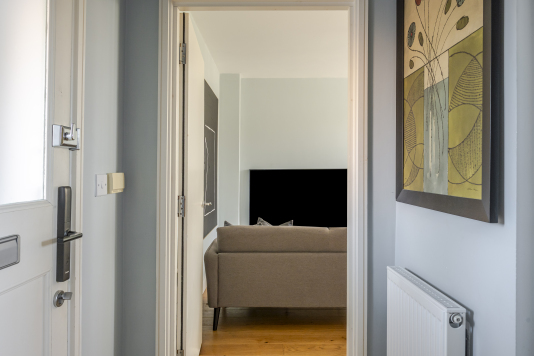 A stylish and welcoming hallway, finished with elegant details and refined lighting, sets the tone for the entire home. Its clean lines and sophisticated design create a grand first impression from the moment you enter.