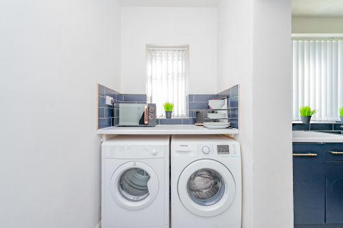 Utility area with washing machine and dryer