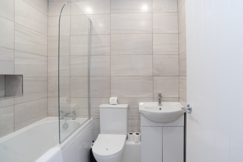 Modern Bathroom with Shower Over Bath & Complimentary Toiletries