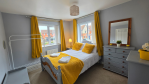 Whether you're traveling with extended family or friends, the second bedroom provides a self-contained retreat. With a private en-suite bathroom, plenty of storage, and some good reads to enjoy, it's a room that truly has it all.