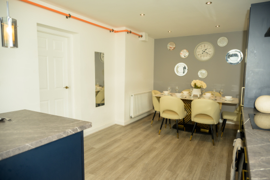 Thoughtfully arranged dining area ideal for breakfast, lunch, or dinner.