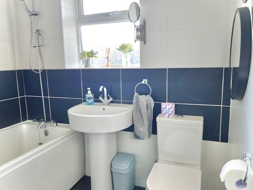Bathroom - Modern bathroom with 3 piece suite and shower over the bath