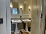 en suite shower room with double sink