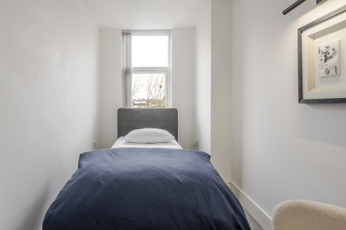 Retreat to this serene and stylish bedroom, designed for ultimate comfort and relaxation. With plush bedding, elegant décor, and soft ambient lighting, it offers a peaceful, luxurious haven to unwind and recharge.