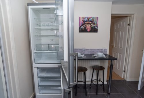 Spotlessly clean appliances, professionally cleaned between every stay, plus a breakfast bar offering additional seating to the dining table and a comfortable workspace.