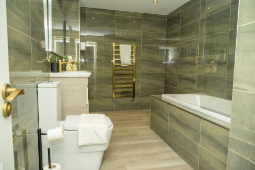 A fresh, well-maintained bathroom with essential amenities provided.