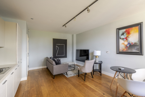 Experience refined comfort in this beautifully designed living room, where sophisticated décor meets effortless elegance. Flooded with natural light, the space features plush seating, stylish accents, and a statement centrepiece that elevates every moment. Perfect for relaxing or entertaining, this room delivers luxury living at its finest.