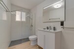 First Floor two bedroom apartment suite bathroom with a shower.