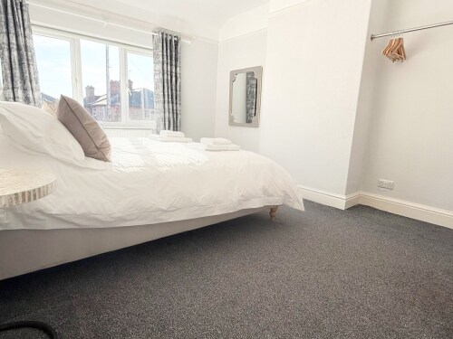 Relax in this spacious bedroom featuring a luxurious super king bed. With stylish décor and a calming atmosphere, it’s the perfect retreat for a peaceful night’s sleep.







