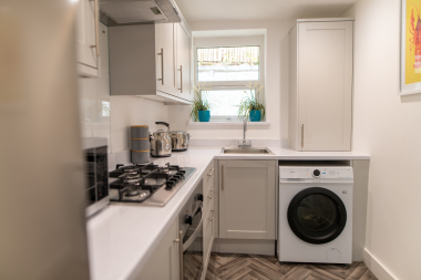 Kitchen with washer dryer