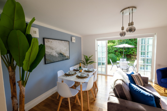 The living/dining area opens out on to a terrace with outdoor dining furniture, a BBQ/grill, and a secluded, fully enclosed private garden for the exclusive use of our guests.