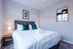 Comfortable bedroom with a king-size zip and link bed that can be separated into two singles upon request.