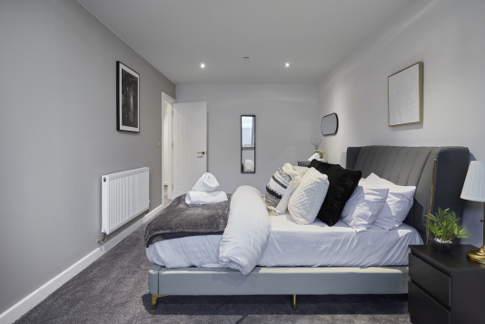 Your private retreat: a stylish double bedroom with a calm, welcoming feel.