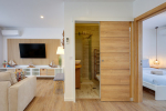 Living room with bathroom door open