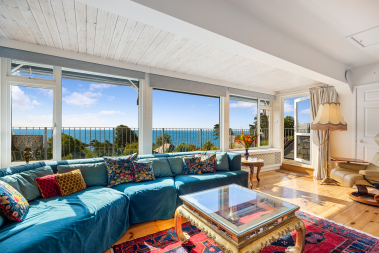 Bedroom 4 / Upstairs lounge with balcony access.